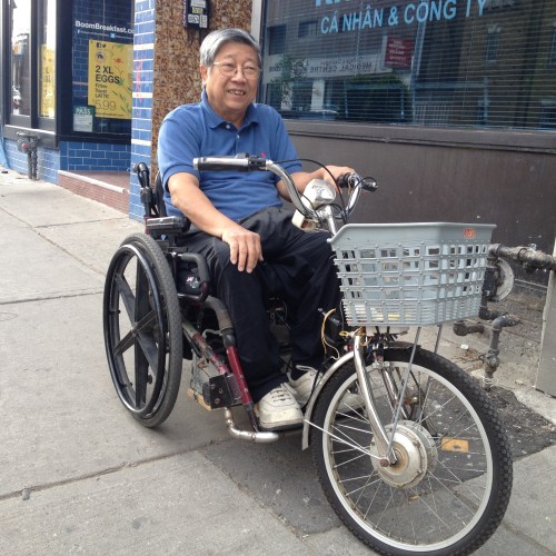 Hung Ho, a retired computer programmer, ingeniously reinvented his wheelchair! Equipped with a basket, welded bicycle tire, handlebars, and a headlight, Hung is cruising the city streets like no other. 