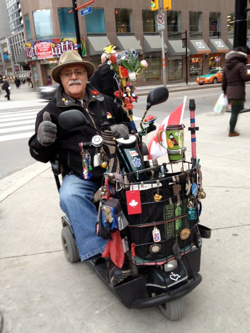 James hangs pins, buttons, stickers and key chains he's collected over the years - "The kids love the Mickey Mouse and other things and they always come over to talk to me about them". 
