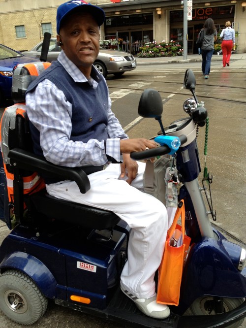 Alias is styling on his scooter which he's accessorized for all his functional needs. His additions include bike lights from MEC, side mirrors, a horn and a place to carry his cell phone. Nice! 